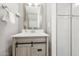 This stylish powder room features a modern vanity with ample storage, updated fixtures, and a framed mirror at 4630 N 68Th St # 213, Scottsdale, AZ 85251