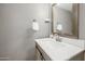 Updated powder room features a stylish vanity, designer mirror, and modern hardware, providing a luxurious feel at 4630 N 68Th St # 213, Scottsdale, AZ 85251