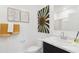 Bright bathroom featuring a modern vanity with marble countertop and decorative wall art at 469 W Freedom St, Florence, AZ 85132