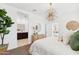 Spacious bedroom showcasing decor, natural light and a view into the modern ensuite bathroom at 469 W Freedom St, Florence, AZ 85132