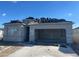 New construction home featuring a spacious two car garage and tile roof installation at 469 W Freedom St, Florence, AZ 85132