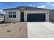 Charming single-story home with a two-car garage and neutral-colored exterior at 469 W Freedom St, Florence, AZ 85132