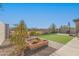 Spacious backyard featuring a sandbox, artificial grass, and a view of the surrounding community at 5325 N 188Th Ave, Litchfield Park, AZ 85340