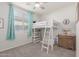 Bright bedroom featuring a unique loft bed, creating a cozy and playful space at 5325 N 188Th Ave, Litchfield Park, AZ 85340