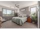 Serene bedroom featuring a large window, neutral color scheme, and stylish furnishings at 5325 N 188Th Ave, Litchfield Park, AZ 85340