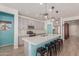 Stylish kitchen featuring stainless steel appliances, large island, and breakfast bar seating at 5325 N 188Th Ave, Litchfield Park, AZ 85340