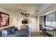 Well-lit bedroom featuring a large bed, neutral carpet, ceiling fan, and a desk by the windows at 5819 E Calle Del Media --, Phoenix, AZ 85018