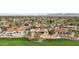 Aerial view of the property highlighting its manicured landscaping, golf course frontage, and the surrounding community at 5827 E Sanna St, Paradise Valley, AZ 85253