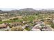 Beautiful aerial showcasing the lush golf course and distant mountain views at 5827 E Sanna St, Paradise Valley, AZ 85253