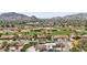 Beautiful aerial showcasing the lush golf course and distant mountain views at 5827 E Sanna St, Paradise Valley, AZ 85253