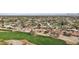 Aerial view of the property highlighting its manicured landscaping, golf course frontage, and the surrounding community at 5827 E Sanna St, Paradise Valley, AZ 85253