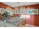 Bar area with display cabinets, granite countertops, and decorative serving ware at 5827 E Sanna St, Paradise Valley, AZ 85253