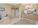 Another view of the bathroom with dual sinks, ample counter space, and decorative wallpaper at 5827 E Sanna St, Paradise Valley, AZ 85253