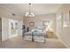 Bright bedroom with a metal frame bed, neutral decor, and plantation shutters at 5827 E Sanna St, Paradise Valley, AZ 85253