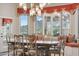 Dining area with view windows, custom window treatments, and a large wood dining table at 5827 E Sanna St, Paradise Valley, AZ 85253