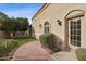 Charming home exterior featuring a well-manicured lawn, brick walkway, and lush landscaping for curb appeal at 5827 E Sanna St, Paradise Valley, AZ 85253