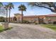 Inviting home exterior with a well-maintained brick driveway, mature landscaping and a charming facade at 5827 E Sanna St, Paradise Valley, AZ 85253