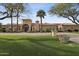 Expansive estate featuring a manicured lawn and an eye-catching arched entryway at 5827 E Sanna St, Paradise Valley, AZ 85253