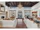 Open living room features a fireplace, coffered ceiling, and exterior views at 5827 E Sanna St, Paradise Valley, AZ 85253