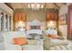 Opulent main bedroom features elegant seating, a bed, and designer window treatments at 5827 E Sanna St, Paradise Valley, AZ 85253