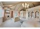 Spacious main bedroom featuring vaulted ceilings, a fireplace, and ample natural light at 5827 E Sanna St, Paradise Valley, AZ 85253