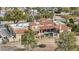 Aerial view of a backyard with a pool, red tiled roof, and desert landscape at 5827 E Sanna St, Paradise Valley, AZ 85253