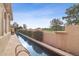 Backyard pool featuring verdant shrubs and decorative landscaping overlooking the manicured greens of the golf course at 5827 E Sanna St, Paradise Valley, AZ 85253