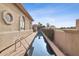 Long swimming pool with access ladder surrounded by manicured landscaping and mountain views at 5827 E Sanna St, Paradise Valley, AZ 85253