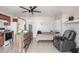 Neutral colored living space with tiled flooring and a leather reclining chair at 5952 W Coronado Rd, Phoenix, AZ 85035