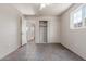 Bedroom features tile flooring, neutral paint throughout, closet, and a window at 5952 W Coronado Rd, Phoenix, AZ 85035