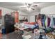 Bedroom featuring neutral-colored walls, ceiling fan and closet with plenty of space at 5952 W Coronado Rd, Phoenix, AZ 85035