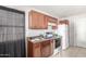 Kitchen featuring brown wooden cabinets and tile floor at 5952 W Coronado Rd, Phoenix, AZ 85035