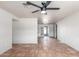 Spacious living room area with tiled flooring leading into the kitchen and outdoor spaces at 5952 W Coronado Rd, Phoenix, AZ 85035