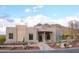 Exterior of a luxury single-Gathering home with desert landscaping and mountain views in the background at 6038 E Agave Cir, Carefree, AZ 85377