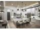 Bright kitchen with white cabinets, stainless steel appliances, and island seating, with barrel brick ceiling at 6038 E Agave Cir, Carefree, AZ 85377