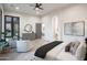 Spacious main bedroom with natural light, hardwood floors, a ceiling fan, and stylish furnishings at 6038 E Agave Cir, Carefree, AZ 85377