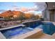 Relaxing backyard pool and spa with scenic mountain views at sunset at 6038 E Agave Cir, Carefree, AZ 85377