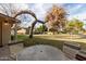 Inviting backyard with seating area, citrus trees, and mature landscaping at 628 Leisure World --, Mesa, AZ 85206