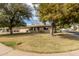 Charming single-story home featuring stone accents, desert landscaping, and an attached two-car garage at 628 Leisure World --, Mesa, AZ 85206