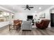 Bright living room featuring modern furnishings, a ceiling fan, and natural light from the window at 628 Leisure World --, Mesa, AZ 85206