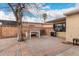 Private backyard with brick-paved patio, white table, and a grill perfect for outdoor entertaining at 7006 N 14Th Ave, Phoenix, AZ 85021