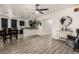 Open-concept living space with stylish floors, a cozy seating area, and a view of the adjacent kitchen at 7006 N 14Th Ave, Phoenix, AZ 85021