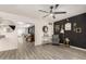 Inviting living room featuring sleek floors, modern decor, and a stylish bar cart at 7006 N 14Th Ave, Phoenix, AZ 85021