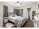 Serene main bedroom with plush carpeting, a comfortable bed, and elegant window treatments at 7006 N 14Th Ave, Phoenix, AZ 85021