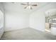 A bedroom with white walls, a ceiling fan, and a window offering natural light at 7557 W Colter St, Glendale, AZ 85303