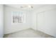 Bedroom featuring a window with blinds, a ceiling fan and closet space at 7557 W Colter St, Glendale, AZ 85303