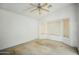 Bright bedroom with a ceiling fan and large window offering natural light at 7557 W Colter St, Glendale, AZ 85303