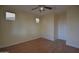 This bedroom features neutral walls, carpeted flooring, and windows at 8776 W Peppertree Ln, Glendale, AZ 85305