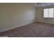 Bright bedroom with a plush neutral carpet and a window for ample light at 8776 W Peppertree Ln, Glendale, AZ 85305