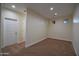 This bedroom features neutral walls, carpeted flooring, and white doors at 8776 W Peppertree Ln, Glendale, AZ 85305